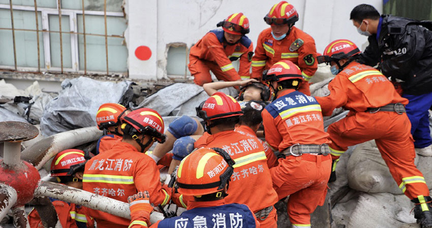 Ten dead, 1 trapped after gym roof collapse in China