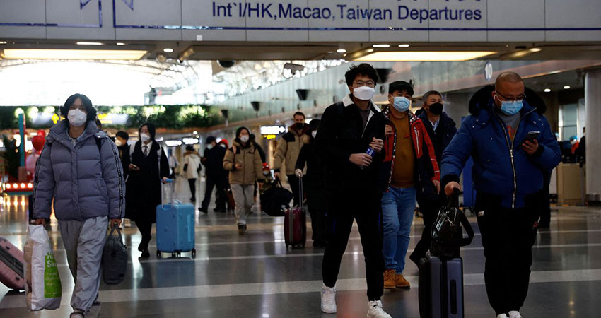 WHO urges travellers to wear masks as new Covid variant spreads